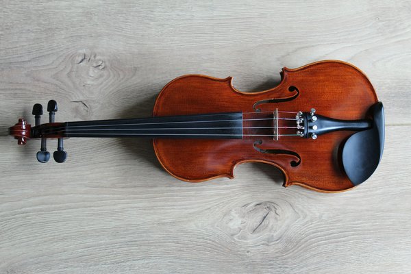 How can you ensure special care for fragile musical instruments like violins and cellos during a UK relocation?